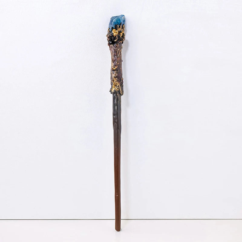 Decorative staff with a blue crystal top on a white background