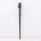Decorative staff with a blue crystal top on a white background