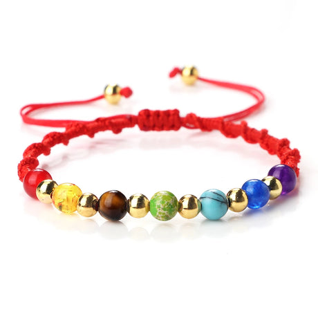 Colorful beaded bracelet with red cord on a white background