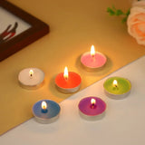 Colorful candles on a surface with a blurred background