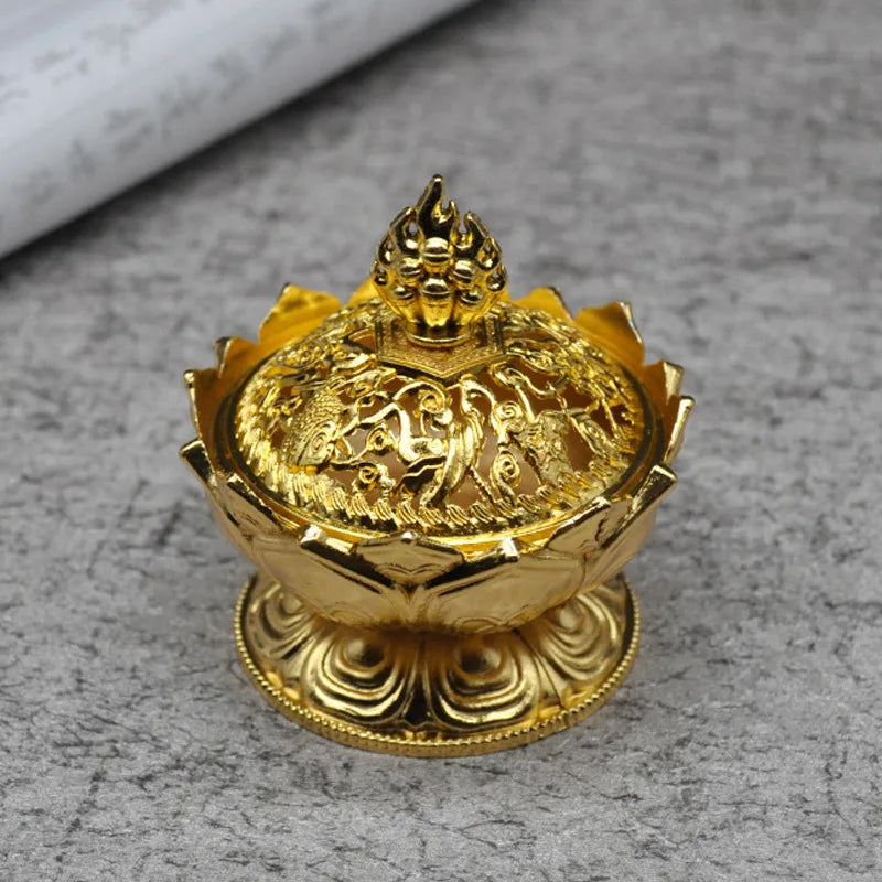Gold decorative item on a gray surface