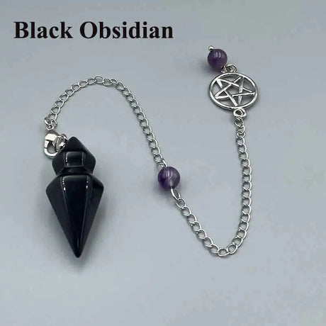 Black obsidian pendulum with chain and purple beads on a light gray background