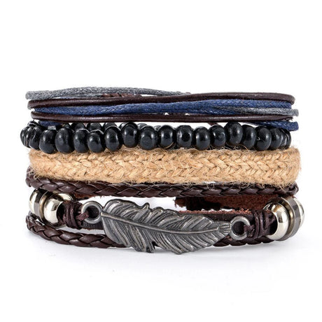 Stack of multi-layered bracelets with leather, beads, and metal feather charm on a white background