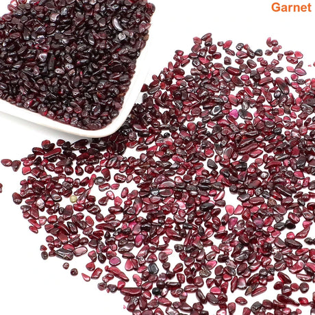 Garnet stones with a bowl on a white background