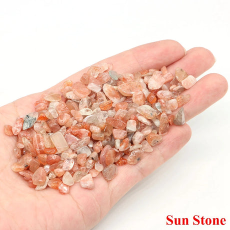 Hand holding small sun stones with 'Sun Stone' text on a white background