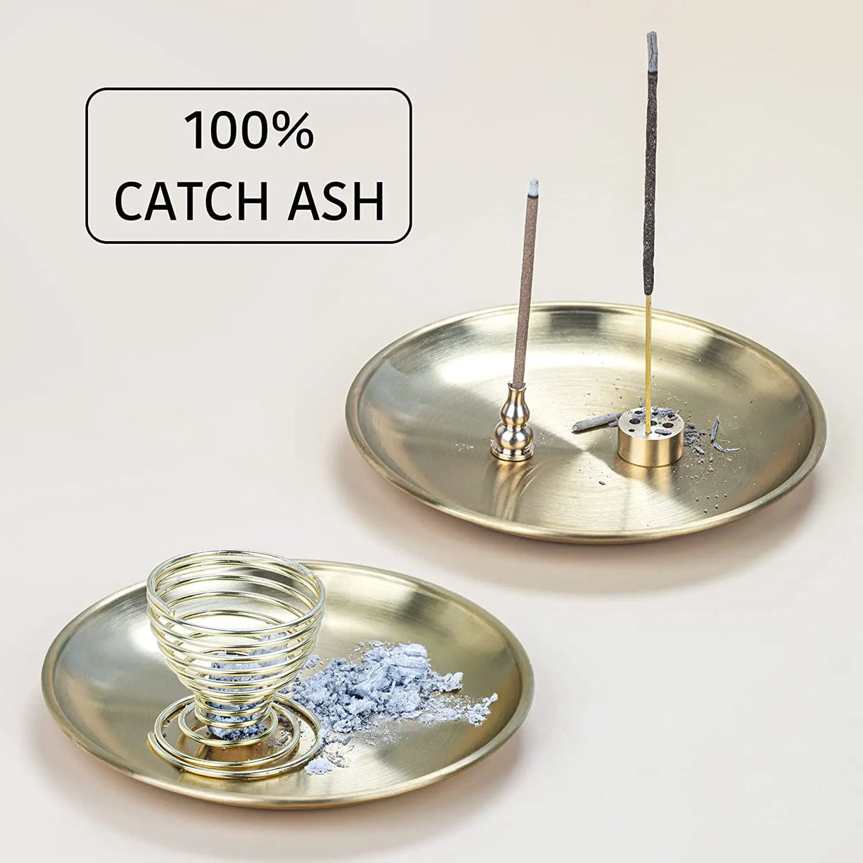 Brass incense holder with glass catch-all and incense sticks on a light background