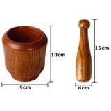 Wooden mortar and pestle with dimensions labeled on a white background