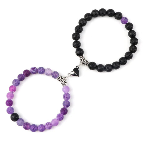 Two beaded bracelets, one purple and one black, on a white background.