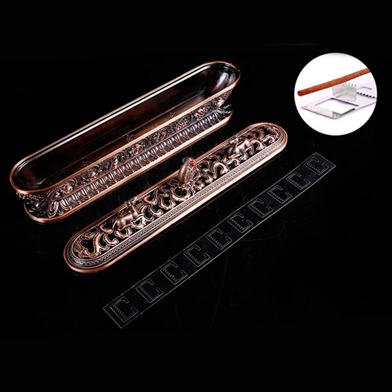 Decorative metal trays with intricate designs on a black background