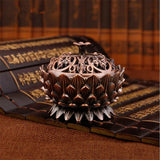 Decorative incense burner on an open book with classical design
