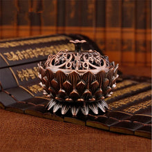 Decorative incense burner on an open book with classical design