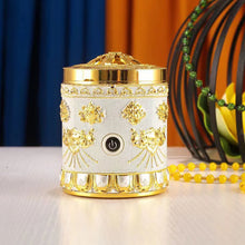 Decorative white and gold lamp with power button on a table