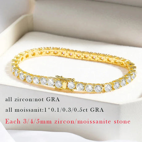 Gold bracelet with zircon and moissanite stones on a white background