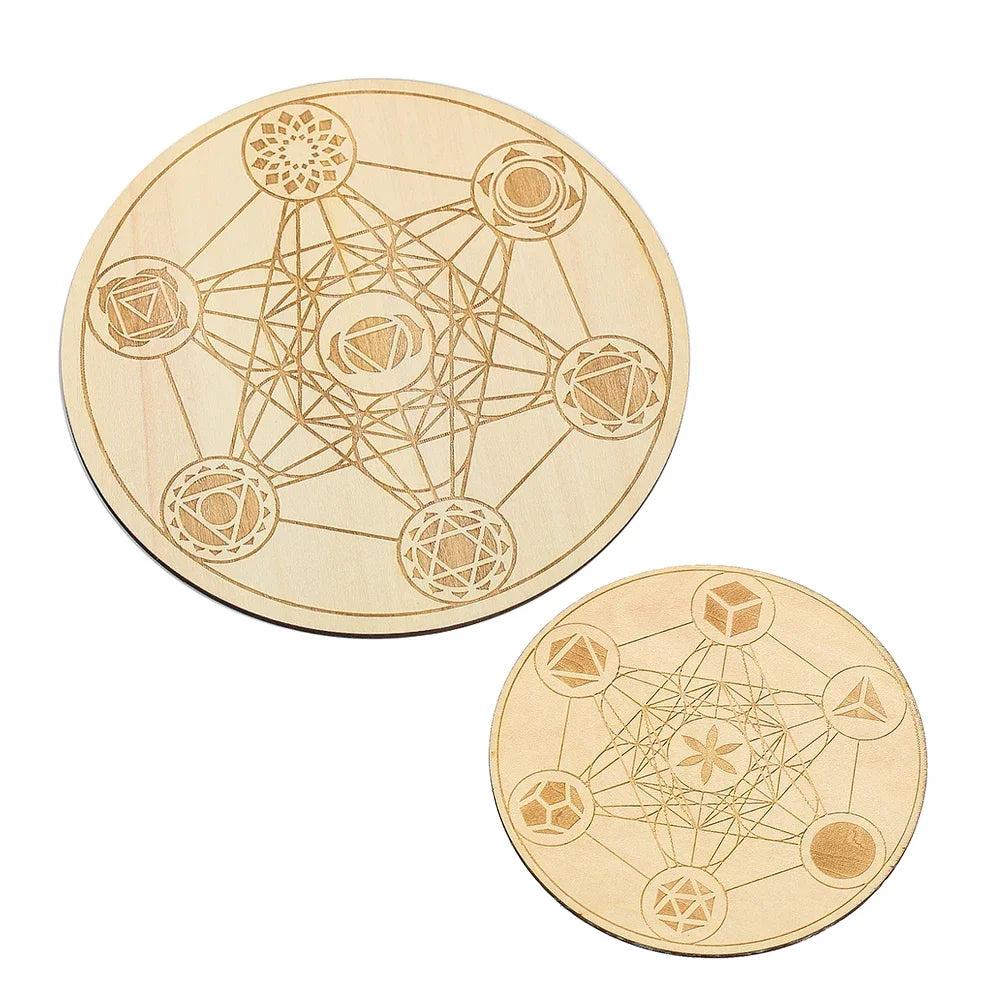 Two wooden discs with geometric designs on a white background
