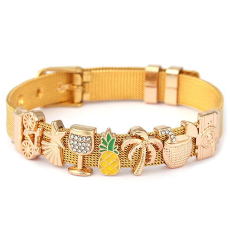 Gold bracelet with various charms on a white background