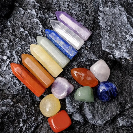 Set of colorful crystals on a dark textured surface