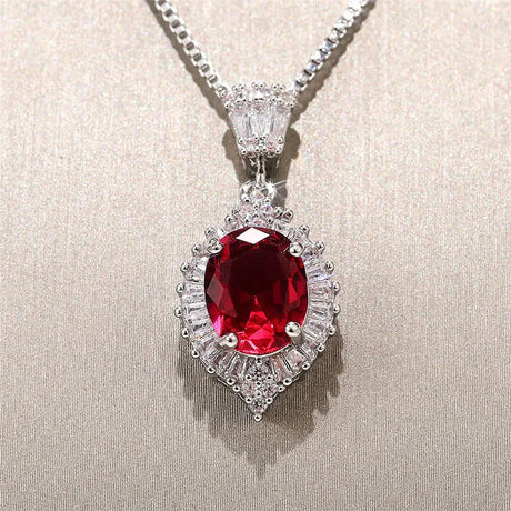 Diamond-encrusted pendant with a red gemstone on a beige background