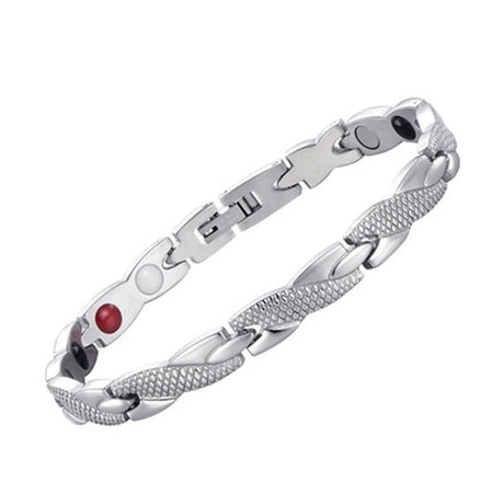 Silver bracelet with a red gemstone on a white background