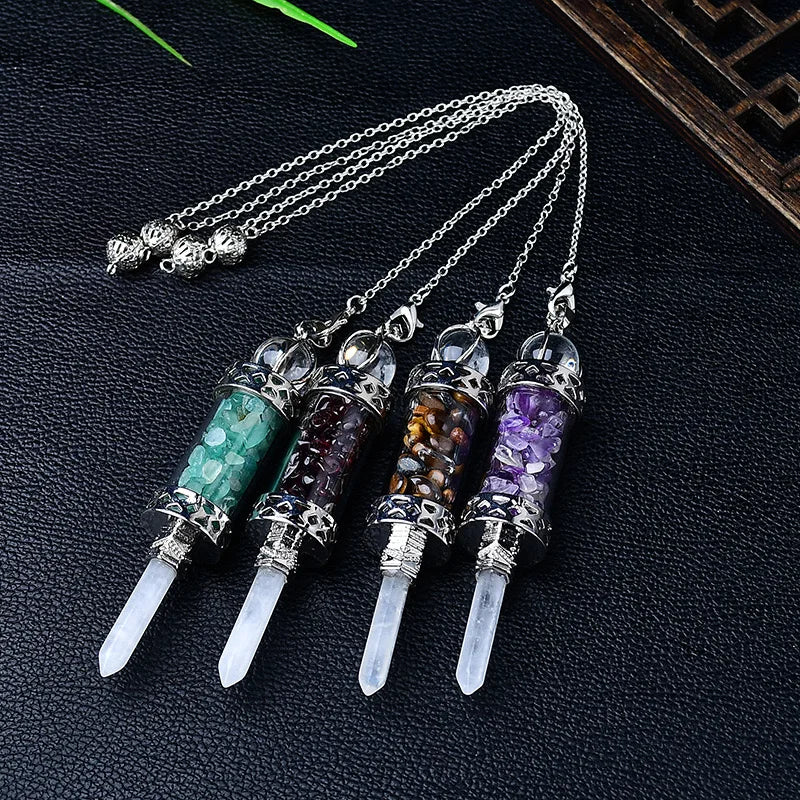 Set of crystalpendants with colored stones on a dark textured surface