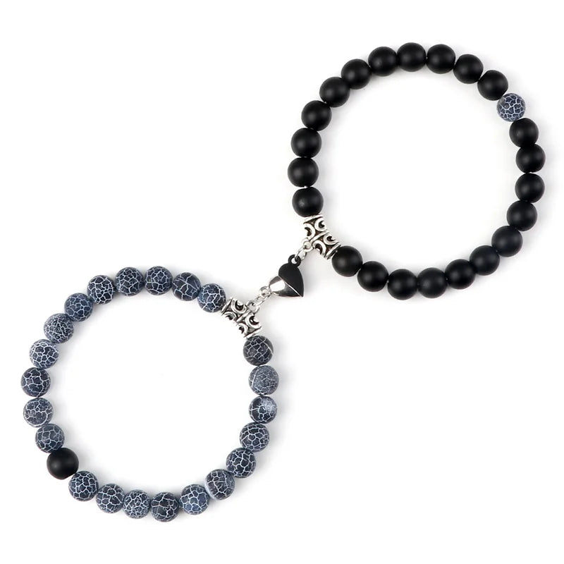 Beaded bracelet with black and gray beads on a white background