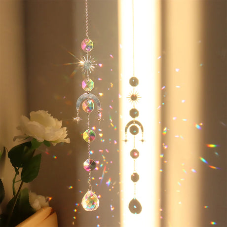 Decorative hanging crystal with rainbow, placed against a neutral background.