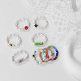 Set of beaded bracelets on a textured white surface