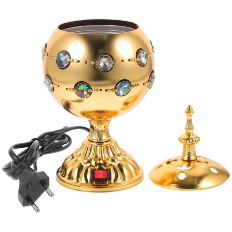 Gold-colored lamp with decorative elements and a power cord on a white background