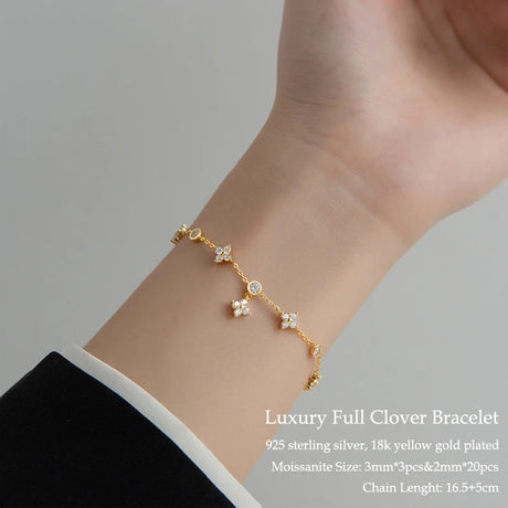 Luxury full clover bracelet on a wrist with product details.