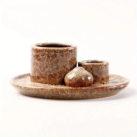 Set of ceramic pots with a plate on a white background