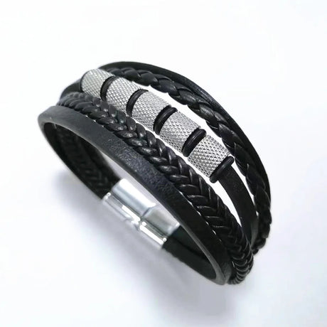 Black braided leather bracelet with metal accents on a white background