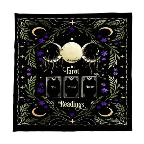 Decorative blanket with tarot design featuring moon phases, stars, and text on a black background.