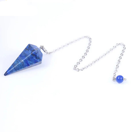 Blue crystal pendulum on a white background
