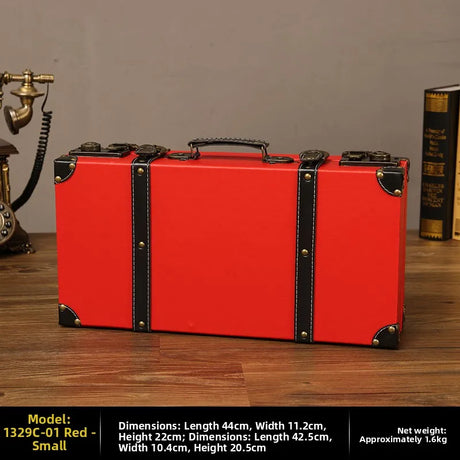 Red suitcase with black accents on a wooden surface, with dimensions and weight information displayed.
