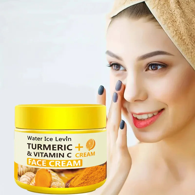 Woman applying face cream with a jar of Water Ice Levin Turmeric + Vitamin C Face Cream in the foreground.