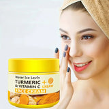 Woman applying face cream with a jar of Water Ice Levin Turmeric + Vitamin C Face Cream in the foreground.