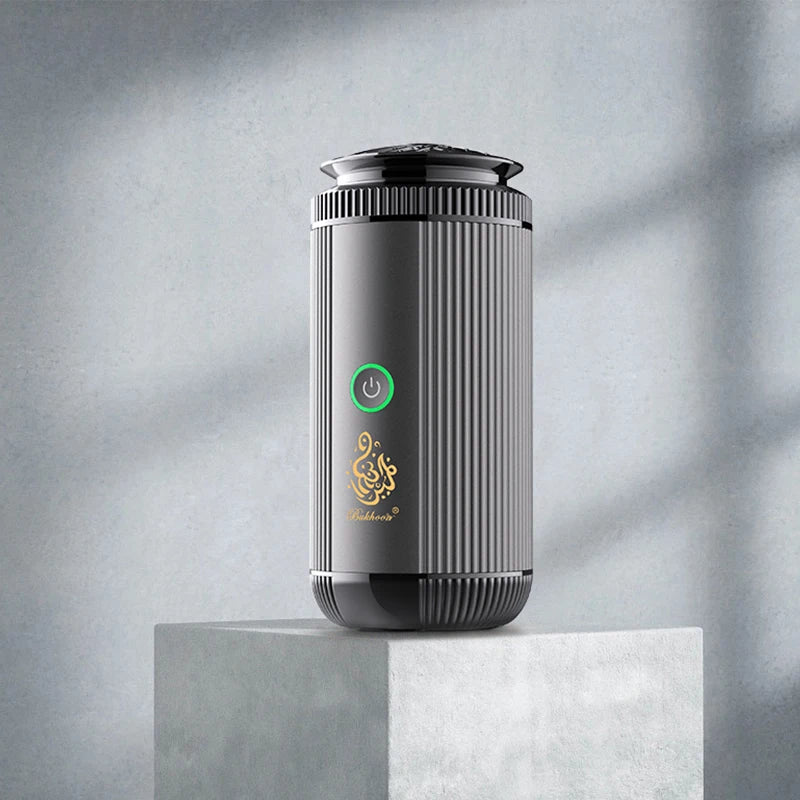 Black and silver cylindrical device with a brand logo on a gray background