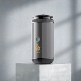 Black and silver cylindrical device with a brand logo on a gray background