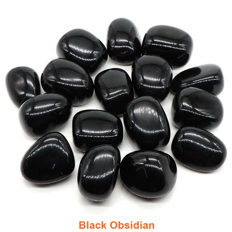 Collection of black obsidian stones on a white background