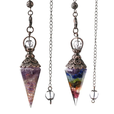 Two crystal pendulums on chains with a brand logo in the corner.