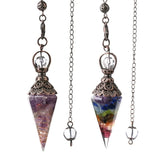 Two crystal pendulums on chains with a brand logo in the corner.