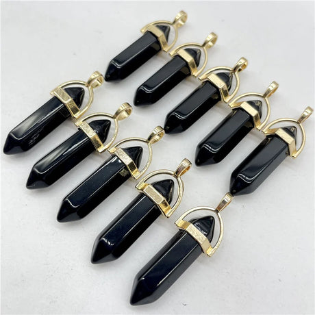 Black crystal pendants with gold accents on a white background