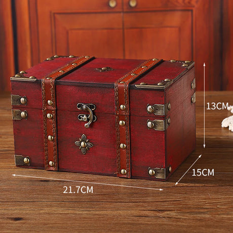 Red wooden treasure chest with brass accents on a wooden surface, with measurements displayed.