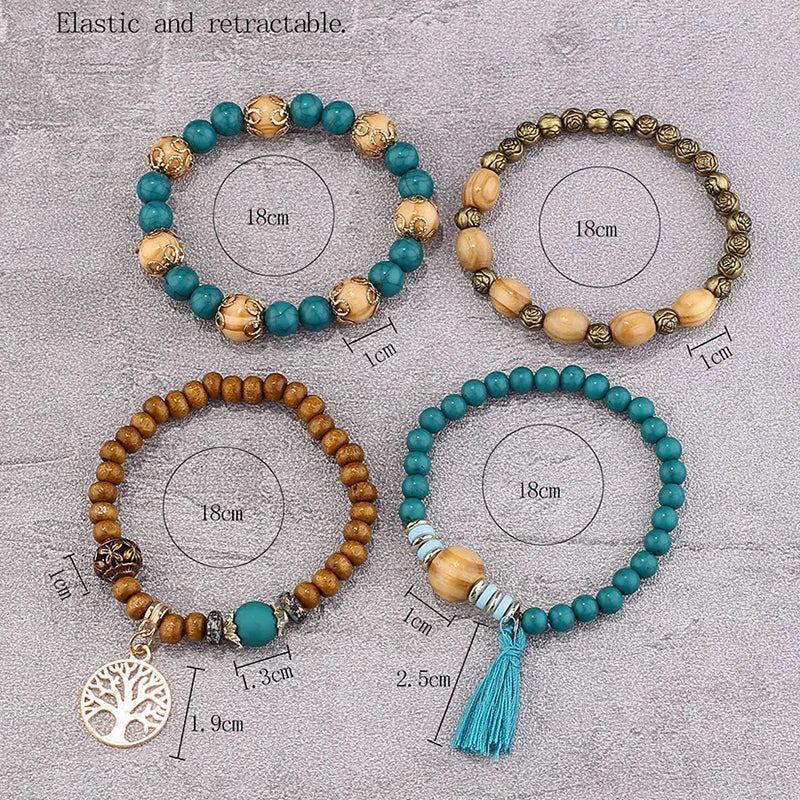 Four beaded bracelets with measurements on a textured surface
