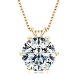 Gold necklace with a round diamond pendant on a white background