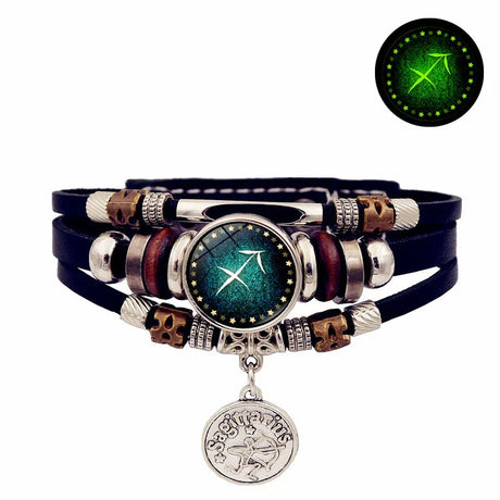 Multistrand bracelet with a central circular component, featuring a compass design, on a white background.