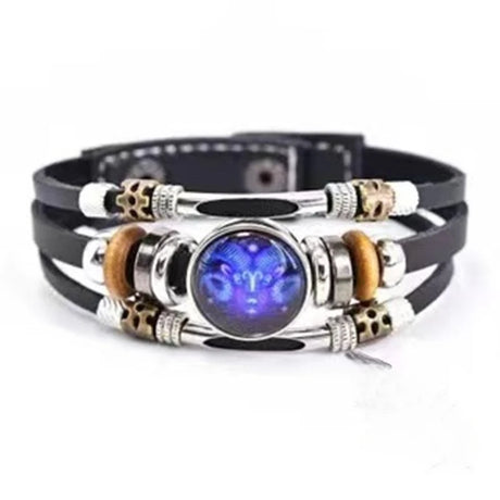 Multistrand bracelet with a central blue gemstone and decorative elements on a white background