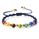 Colorful beaded bracelet with a navy cord on a white background