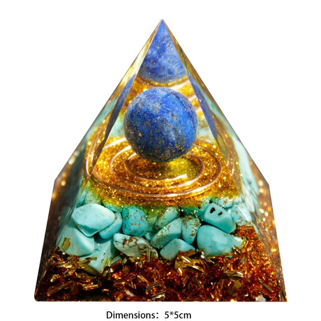 Pyramid-shaped crystal with blue sphere and turquoise stones on a white background
