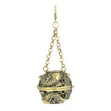 Decorative hanging ball with fish design on a white background