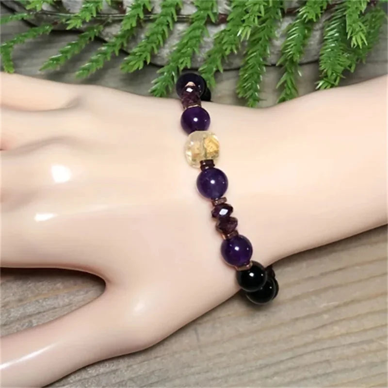 Beaded bracelet on a wrist with a natural background